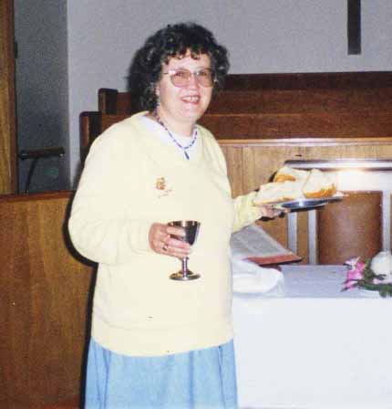 Charlene preparing Communion